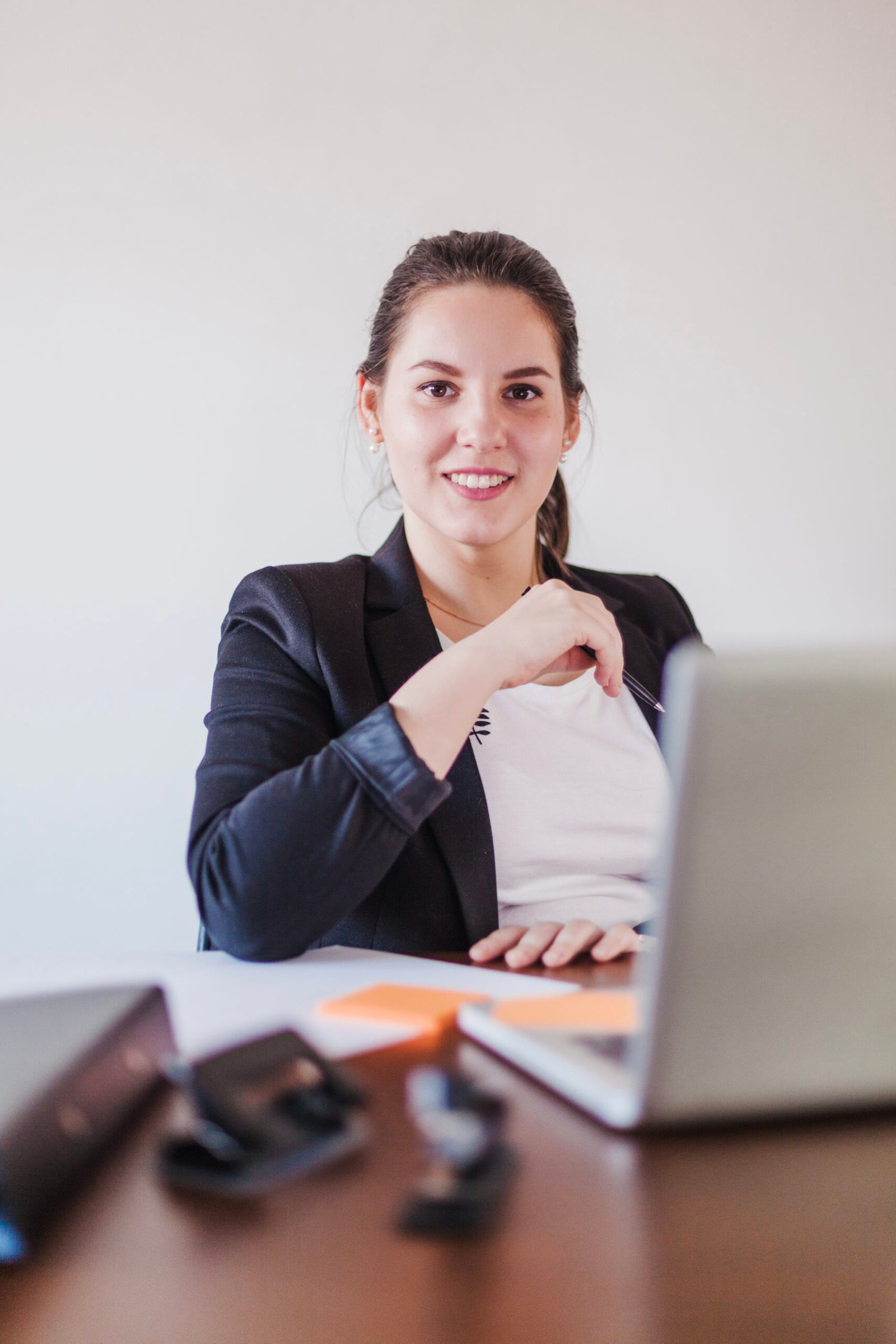 confident-office-working-woman-sitting-laptop